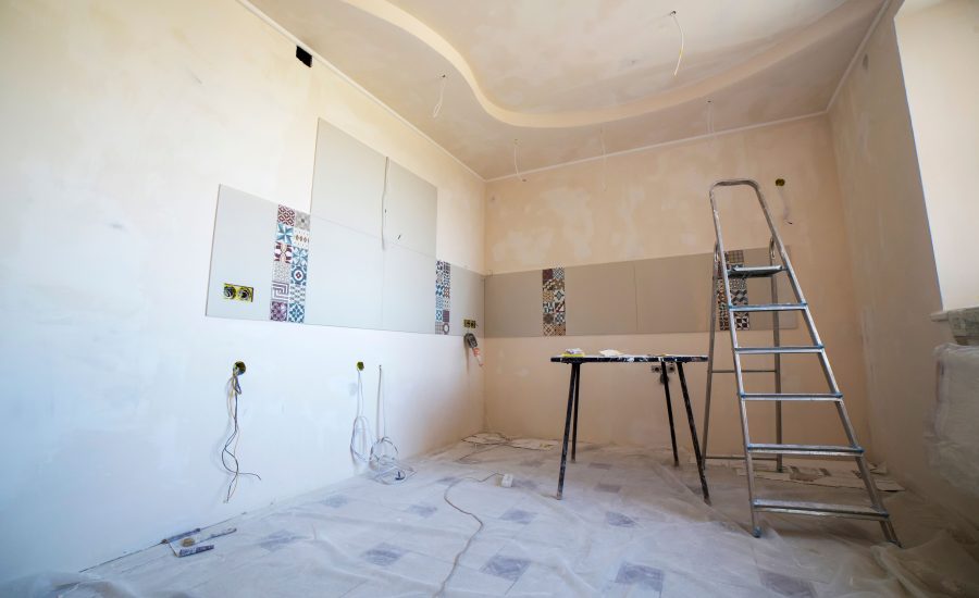 Interior room under renovation with paint, tile, and tools for a 30A remodeling project
