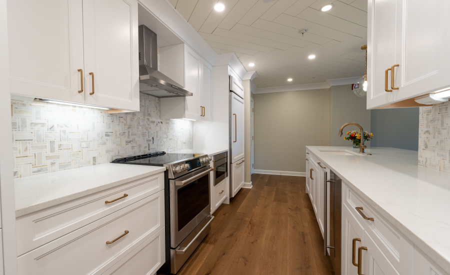 30A home remodel featuring a white kitchen with custom cabinetry and gold hardware