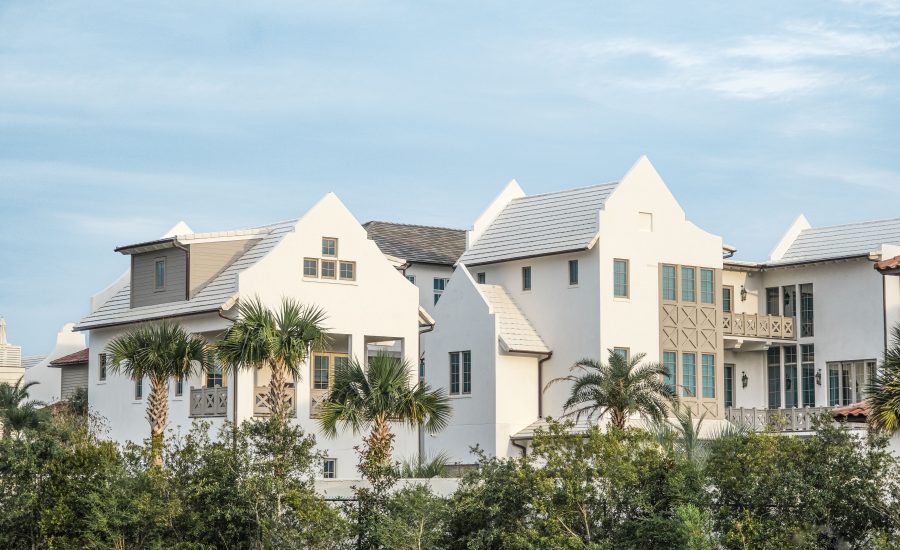 Alys Beach home design featuring white houses surrounded by tropical landscaping